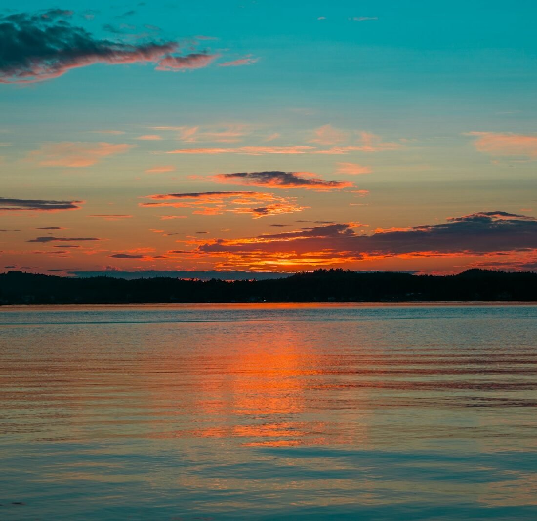 a sunset over a lake